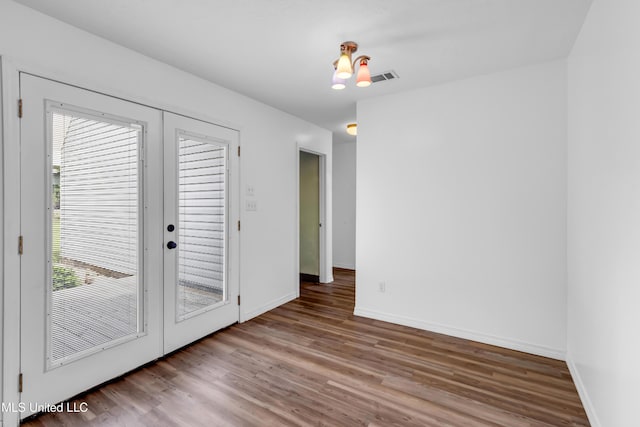 16609 Old River Rd, Vancleave, MS 39565 - spare room with wood finished floors, healthy amount of natural light, baseboards, and french doors