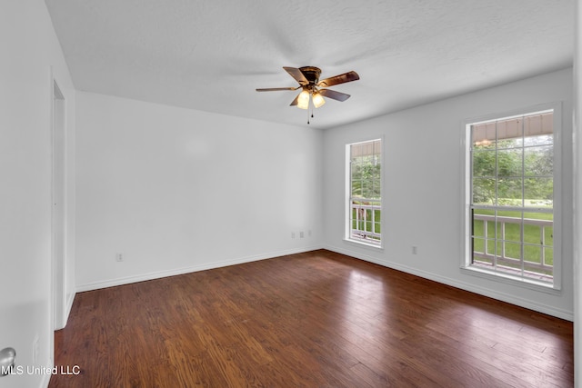 16609 Old River Rd, Vancleave, MS 39565 - empty room with a ceiling fan, dark wood-style floors, and baseboards