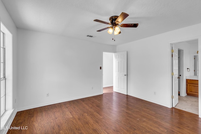 16609 Old River Rd, Vancleave, MS 39565 - unfurnished bedroom with wood finished floors, baseboards, and ensuite bath