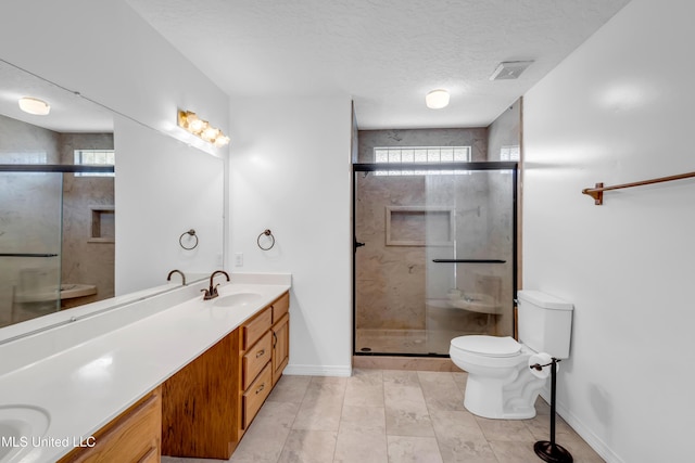 16609 Old River Rd, Vancleave, MS 39565 - bathroom with double vanity, toilet, a stall shower, a textured ceiling, and baseboards