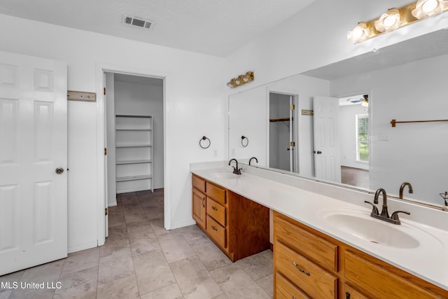 16609 Old River Rd, Vancleave, MS 39565 - full bathroom with double vanity and ceiling fan