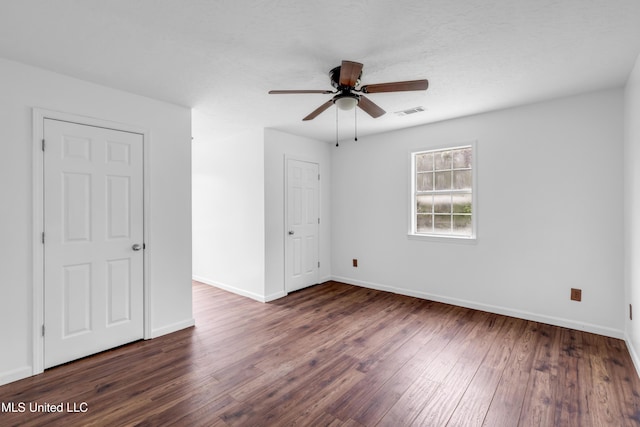 16609 Old River Rd, Vancleave, MS 39565 - unfurnished bedroom with dark wood finished floors, baseboards, and ceiling fan