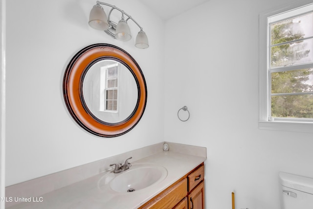 16609 Old River Rd, Vancleave, MS 39565 - bathroom with vanity, toilet, and plenty of natural light