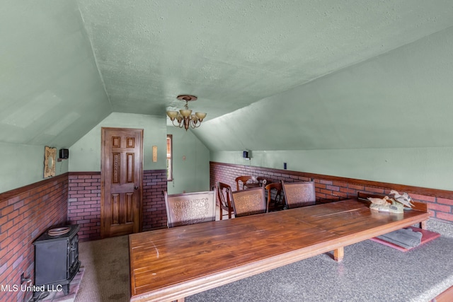 16609 Old River Rd, Vancleave, MS 39565 - carpeted office with a textured ceiling, a wainscoted wall, a wood stove, lofted ceiling, and a chandelier