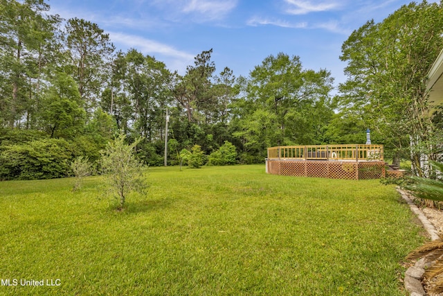 16609 Old River Rd, Vancleave, MS 39565 - view of green lawn with a deck
