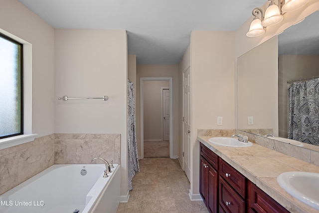 217 Belle Chasse Cir, Jackson, MS 39272 - full bathroom featuring plenty of natural light, double vanity, a bath, and baseboards
