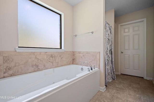 217 Belle Chasse Cir, Jackson, MS 39272 - full bath with a tub with jets and baseboards
