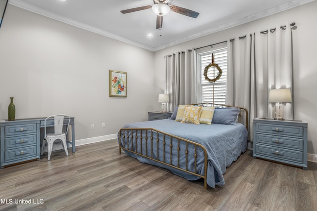 bedroom featuring hardwood / wood-style flooring, ceiling fan, and crown molding