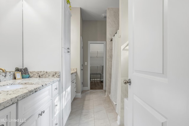 bathroom featuring tile patterned floors, a shower with curtain, and vanity