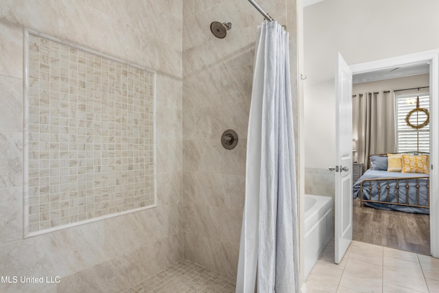 bathroom featuring separate shower and tub