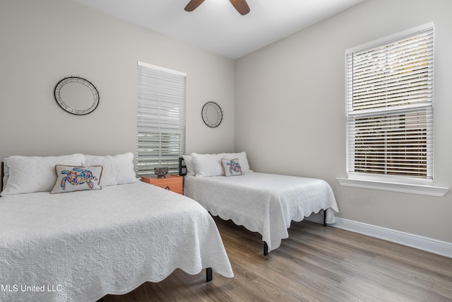 bedroom featuring ceiling fan and wood-type flooring