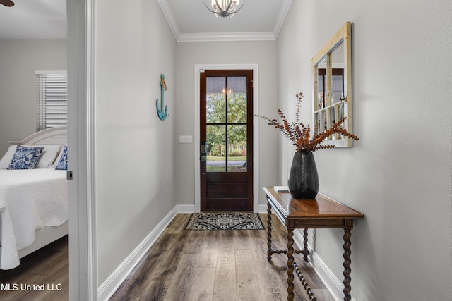 entryway featuring dark hardwood / wood-style floors and crown molding