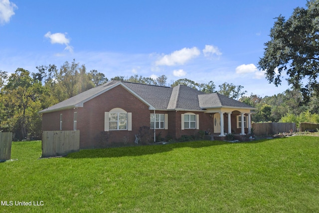 ranch-style home with a front lawn