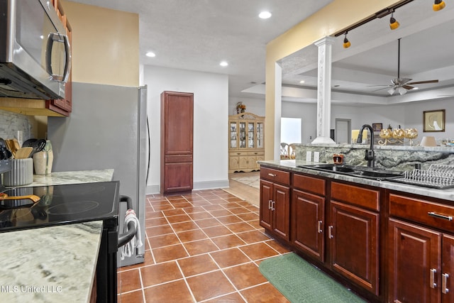 kitchen featuring black range with electric stovetop, ceiling fan, sink, tasteful backsplash, and dark tile patterned flooring