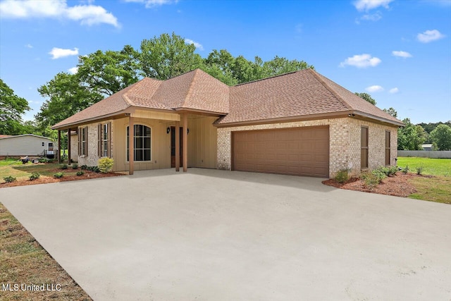 mediterranean / spanish-style house with a garage