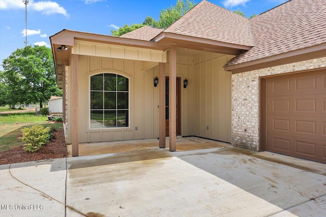 doorway to property featuring a garage