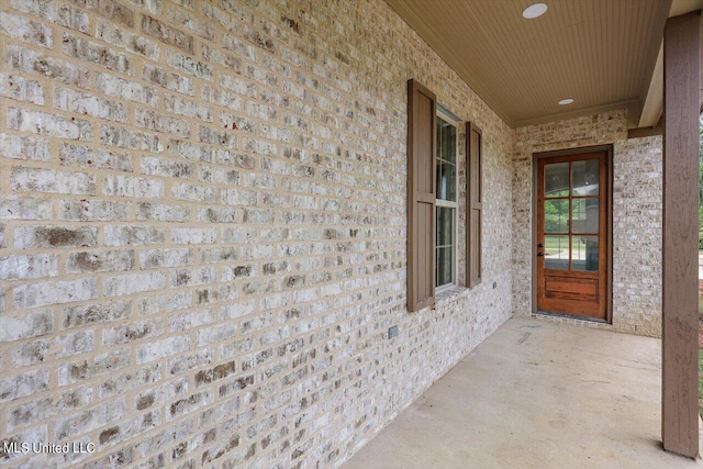 entrance to property with a patio