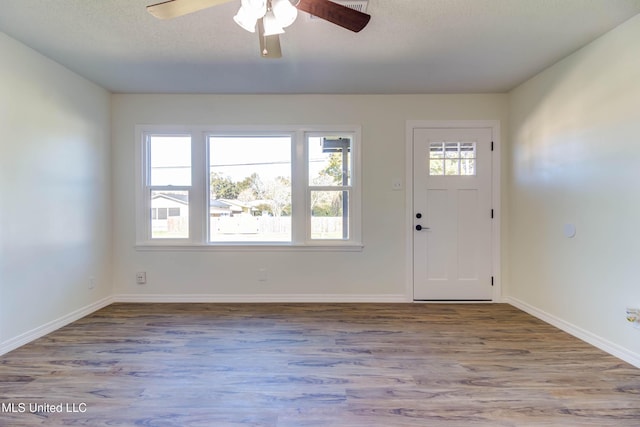 entrance foyer with ceiling fan, a textured ceiling, and light hardwood / wood-style floors