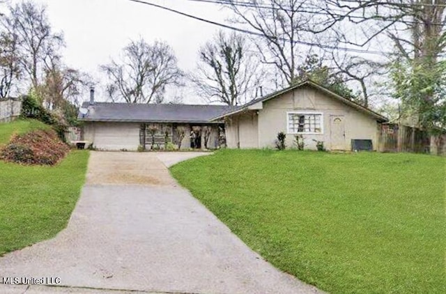 305 Bazinsky Rd, Vicksburg, MS 39180 - ranch-style house featuring concrete driveway, a front lawn, and stucco siding