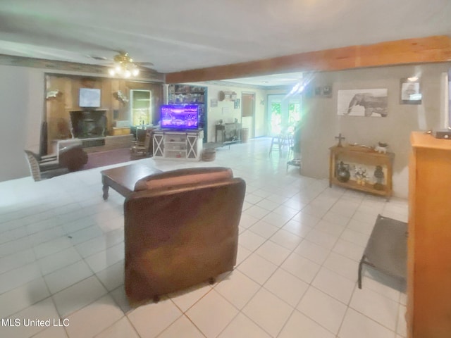 305 Bazinsky Rd, Vicksburg, MS 39180 - living area with light tile patterned floors, ceiling fan, and a wood stove