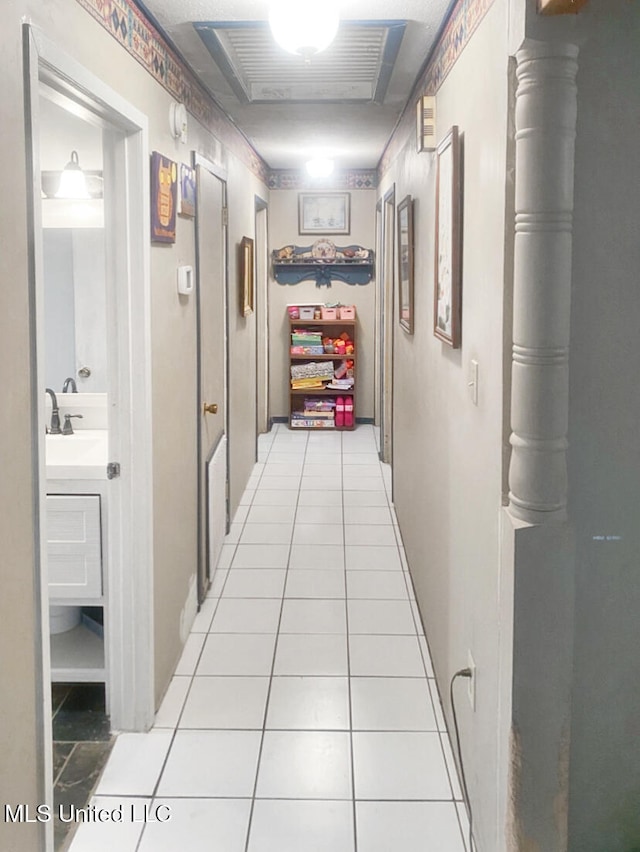 305 Bazinsky Rd, Vicksburg, MS 39180 - hall featuring light tile patterned flooring and a sink