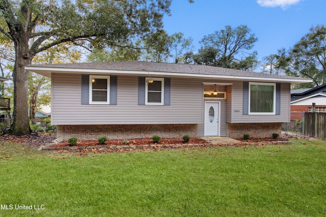 split foyer home with a front lawn