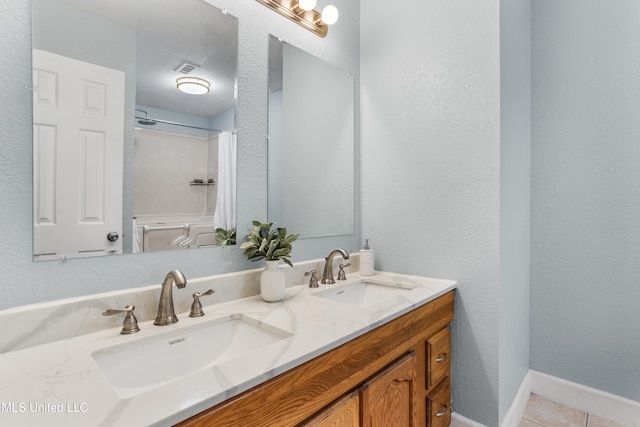 bathroom featuring vanity and tile patterned flooring