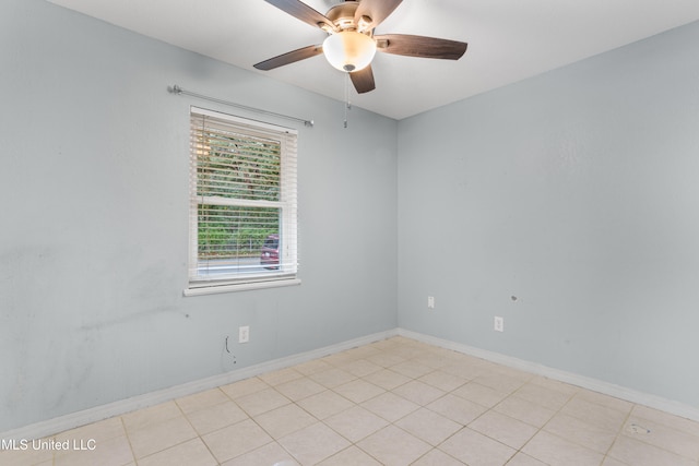 tiled empty room with ceiling fan