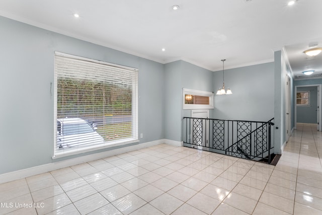 empty room featuring a notable chandelier, light tile patterned floors, and crown molding