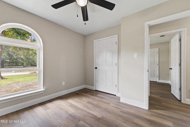 2518 El Viernes St, Gautier, MS 39553 - unfurnished bedroom featuring wood finished floors and ceiling fan