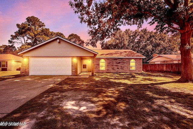 2518 El Viernes St, Gautier, MS 39553 - ranch-style home with brick siding, concrete driveway, and a garage