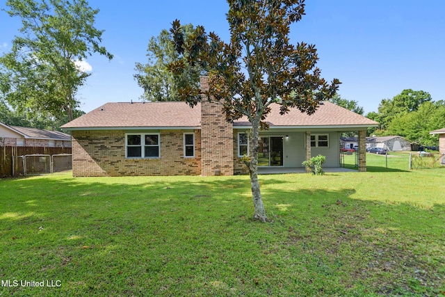 2518 El Viernes St, Gautier, MS 39553 - back of house featuring a chimney, a fenced backyard, a patio, and a gate