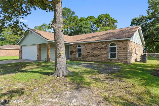 2518 El Viernes St, Gautier, MS 39553 - ranch-style house featuring brick siding, a garage, and driveway