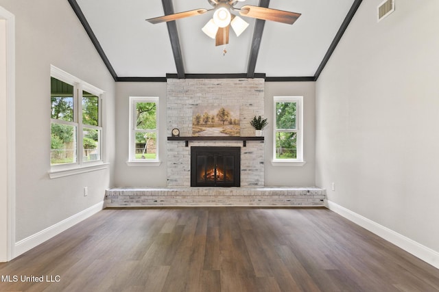 2518 El Viernes St, Gautier, MS 39553 - unfurnished living room featuring plenty of natural light, wood finished floors, a brick fireplace, and ceiling fan