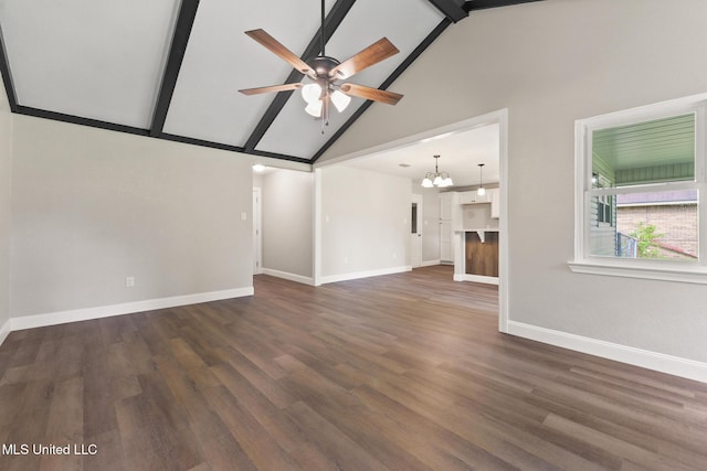 2518 El Viernes St, Gautier, MS 39553 - unfurnished living room with beamed ceiling, a ceiling fan, a chandelier, dark wood-style floors, and high vaulted ceiling
