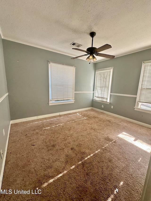 carpeted empty room featuring a textured ceiling and ceiling fan