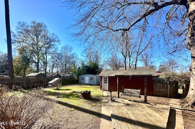 view of yard featuring a patio area and a storage unit