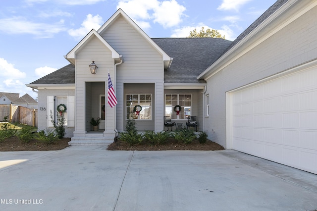 view of front of home featuring a garage and a porch