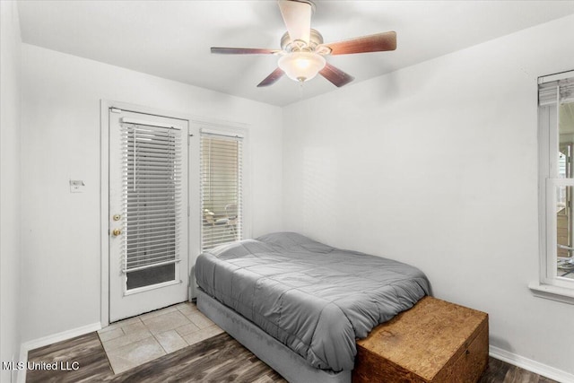 bedroom with ceiling fan and access to exterior