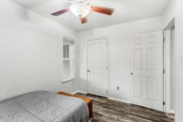 bedroom with ceiling fan and dark hardwood / wood-style floors