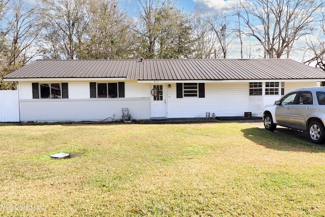 ranch-style house with a front lawn