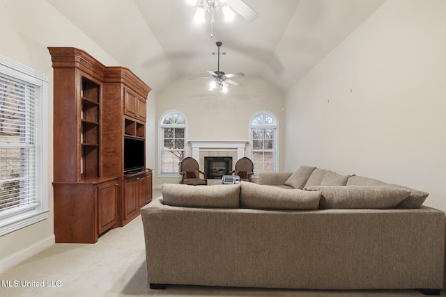 carpeted living room featuring lofted ceiling and ceiling fan