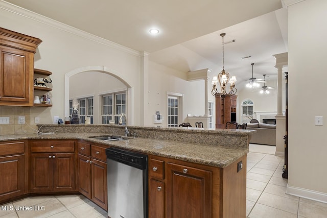 kitchen featuring sink, stainless steel dishwasher, and kitchen peninsula