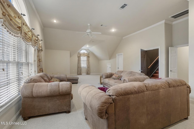 living room with light carpet, ornamental molding, ceiling fan, and lofted ceiling