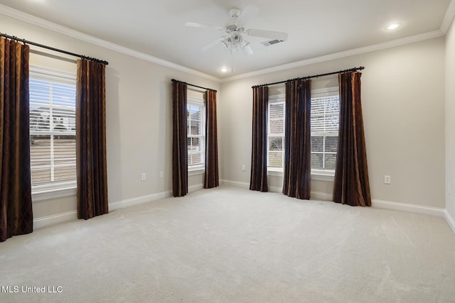 unfurnished room featuring ornamental molding, light carpet, and ceiling fan