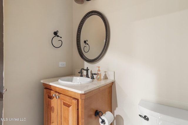 bathroom with vanity and toilet