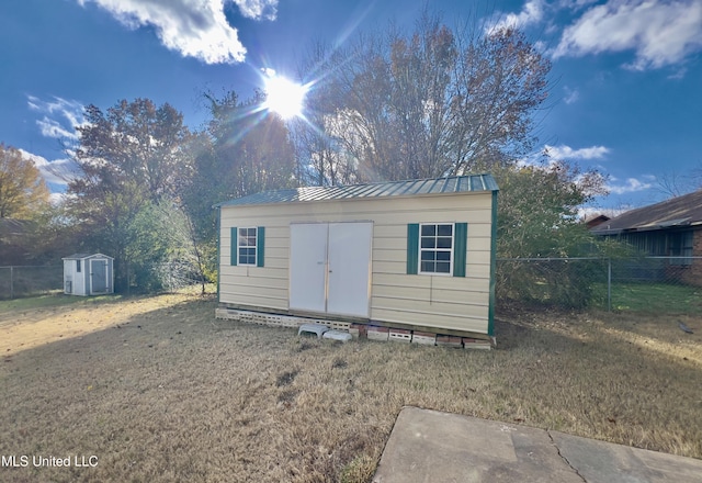 view of outbuilding featuring a lawn