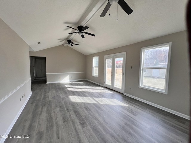 unfurnished living room featuring french doors, vaulted ceiling with beams, dark hardwood / wood-style floors, and ceiling fan