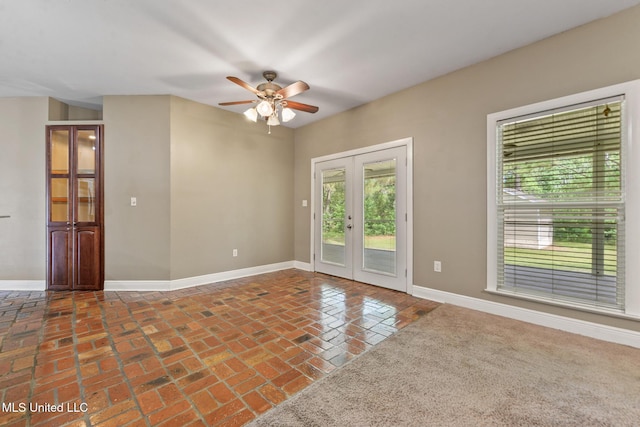 10566 W River Vue, Biloxi, MS 39532 - spare room with ceiling fan, french doors, and brick flooring