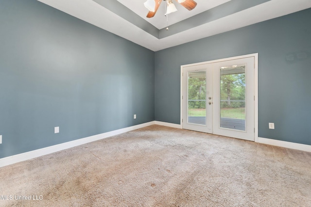10566 W River Vue, Biloxi, MS 39532 - carpeted spare room with french doors, a ceiling fan, and a tray ceiling